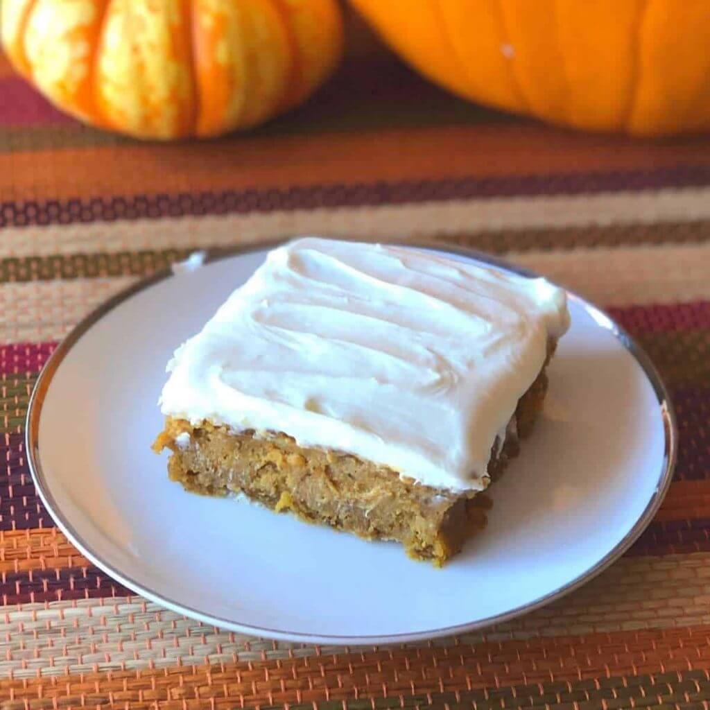An allergy friendly pumpkin bar on a white plate