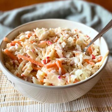 A bowl of cabbage apple salad