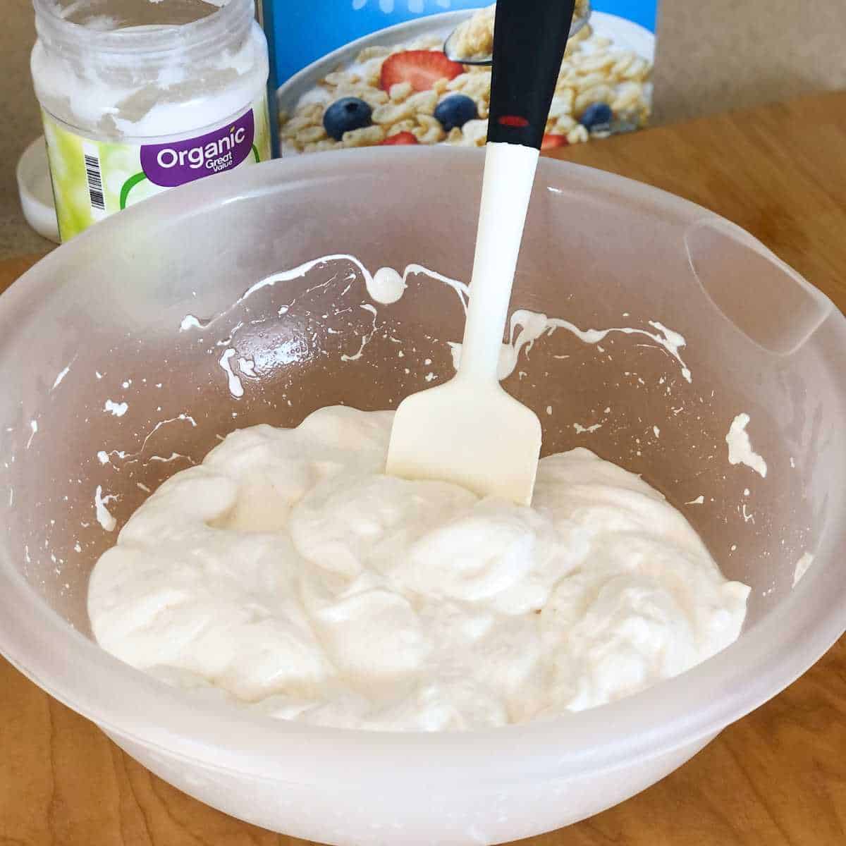 A mixture of melted coconut oil and marshmallows in a bowl.