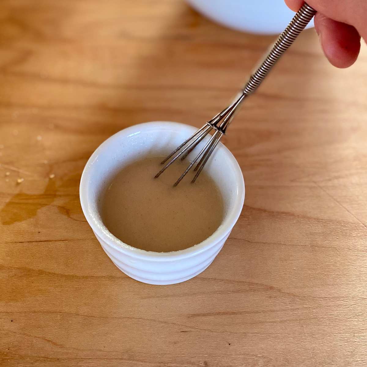 A small bowl with the powdered egg replacer and water mixture.
