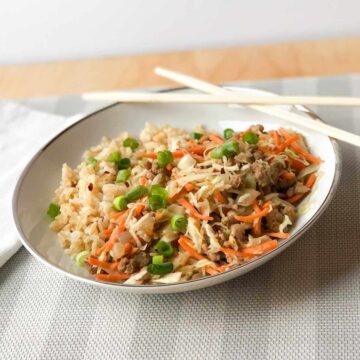 Inside out egg rolls in a bowl with chopsticks